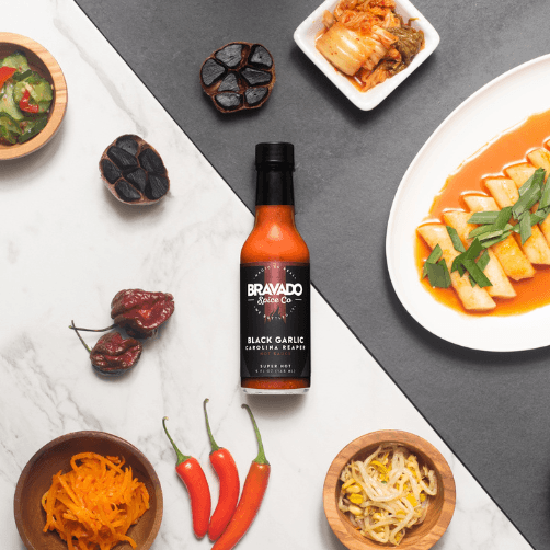 Load image into Gallery viewer, Bravado Spice Co Black Garlic Carolina Reaper Hot Sauce
