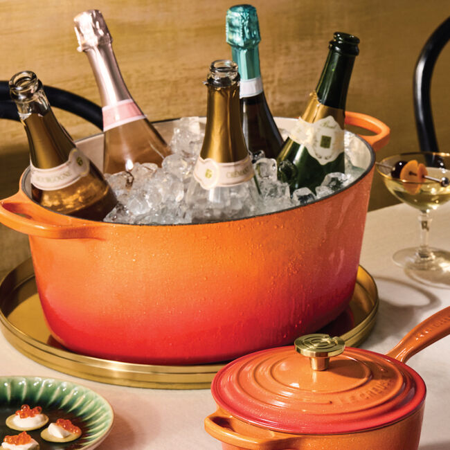 Load image into Gallery viewer, Le Creuset Signature Oval Dutch Oven Flamme Dorée with Crucible Knob
